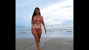 Bikini walking on the beach with sexy hottie