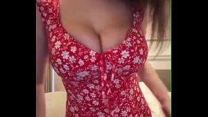 Stepmother in a red dress caresses big milky tits