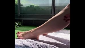 WIFE TEASES A FRIEND ON THE TERRACE WTH HER HUGE FEET