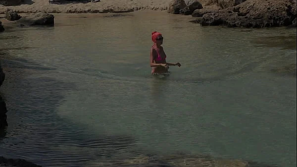 Pink bikini in a beautiful bay