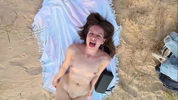 Sucking off my best friend at the public beach and taking cumshot on my pretty face