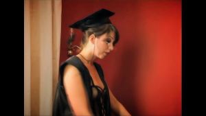 Haley Scott is up next in a dark room with a couple of guys wearing masks