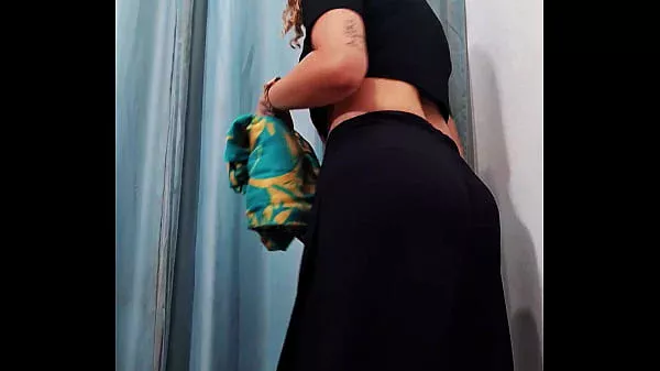 Real sex inside a store fitting room with cumshot on the face.