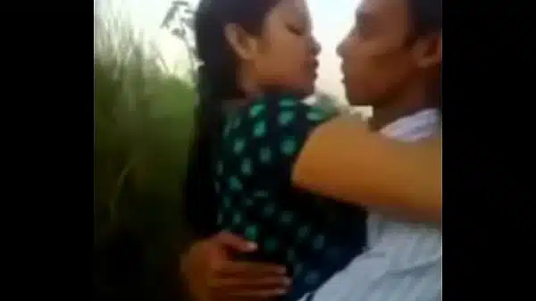 A-BOY-KISS-A-GIRL-IN-SCHOOL-FIELD—XVIDEOSCOM