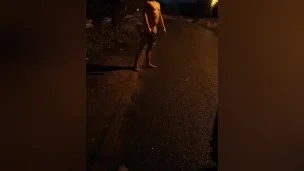 Fishnet stockings in road . Passing car