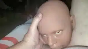 Doll giving head.
