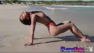 Petite big boobed Ukrainian teen muse Gloria Sol posing naked at the beach